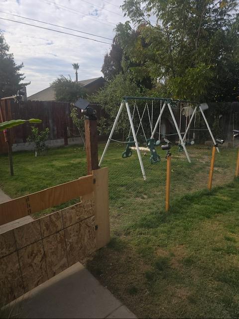 165 East Linden Avenue Reedley, CA 93654 - Photo 4 of 19 a view of a yard