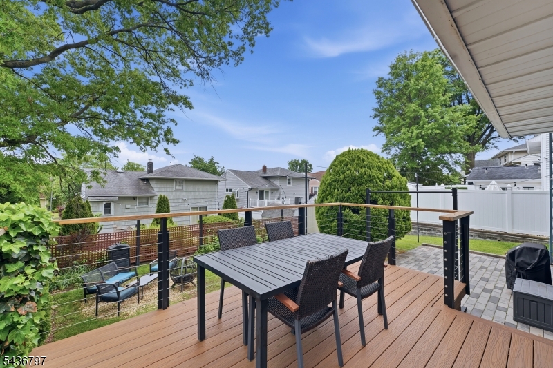 17 Arthur Drive Rutherford, NJ 07070 - Photo 34 of 45 a view of a chairs and table on the wooden deck