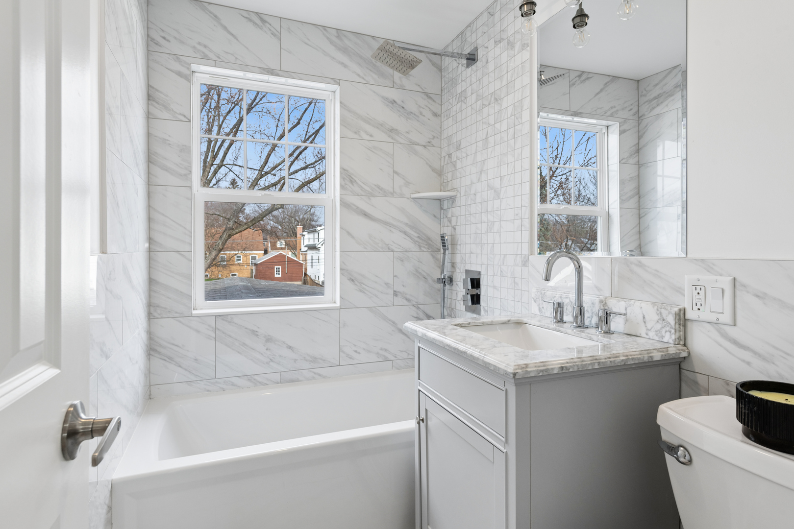 512 North Elm Street Mount Prospect, IL 60056 - Photo 13 of 24 a white bath tub sitting next to a white sink and vanity