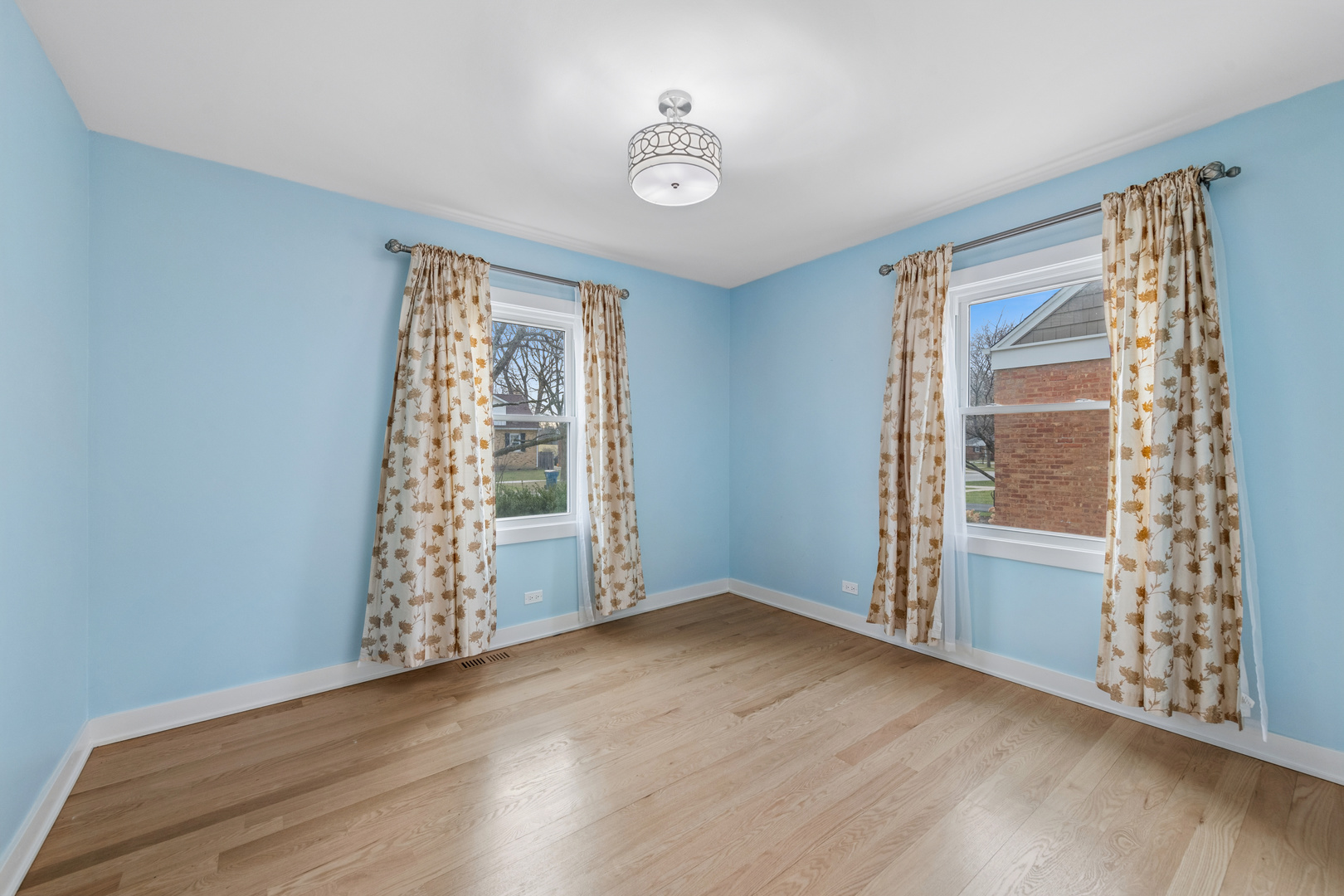 512 North Elm Street Mount Prospect, IL 60056 - Photo 8 of 24 a view of an empty room with window and hardwood floor