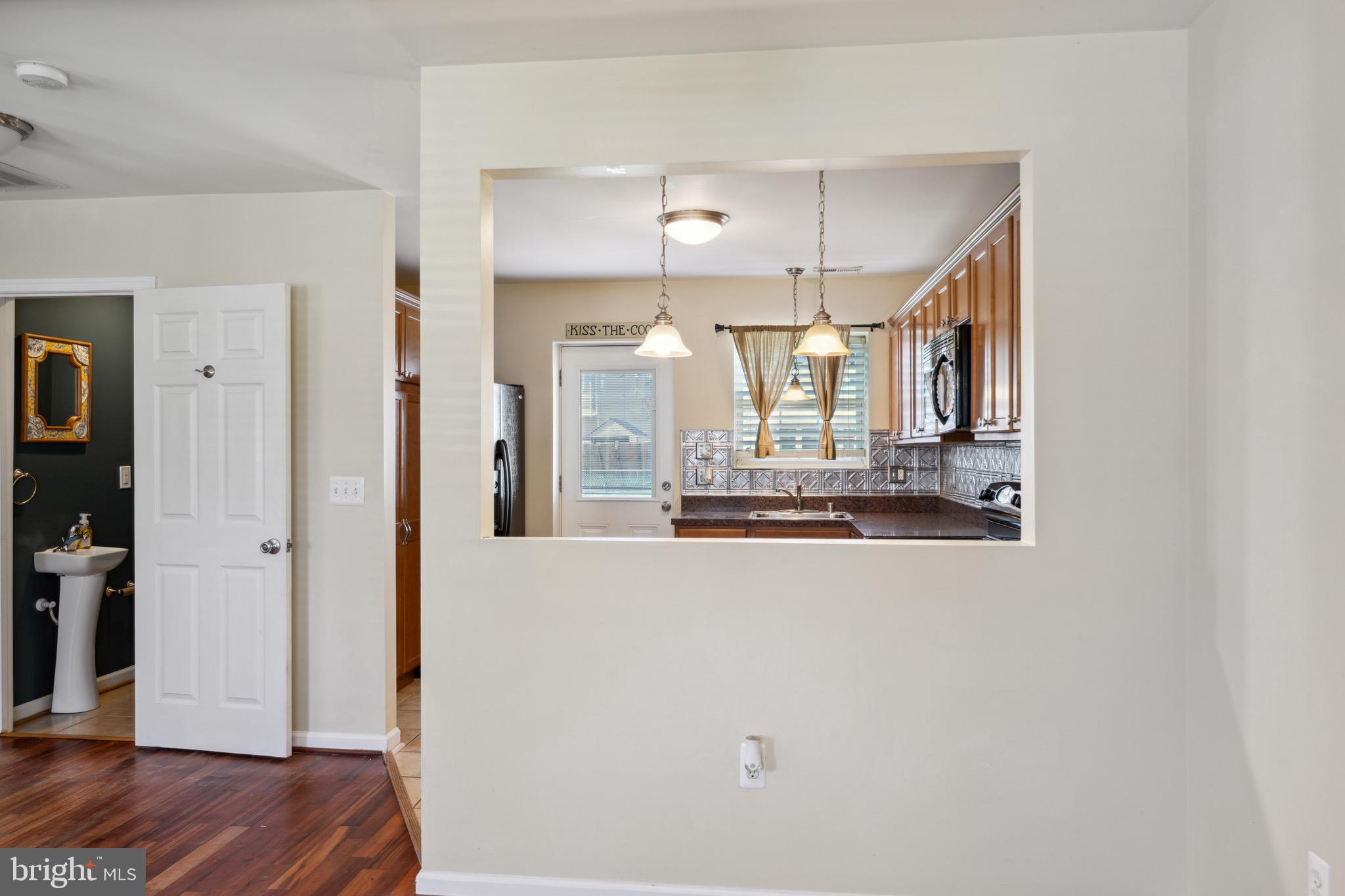 3124 Baybriar Road Baltimore, MD 21222 - Photo 9 of 29 Dining Room w/ Pass Through Window from Kitchen