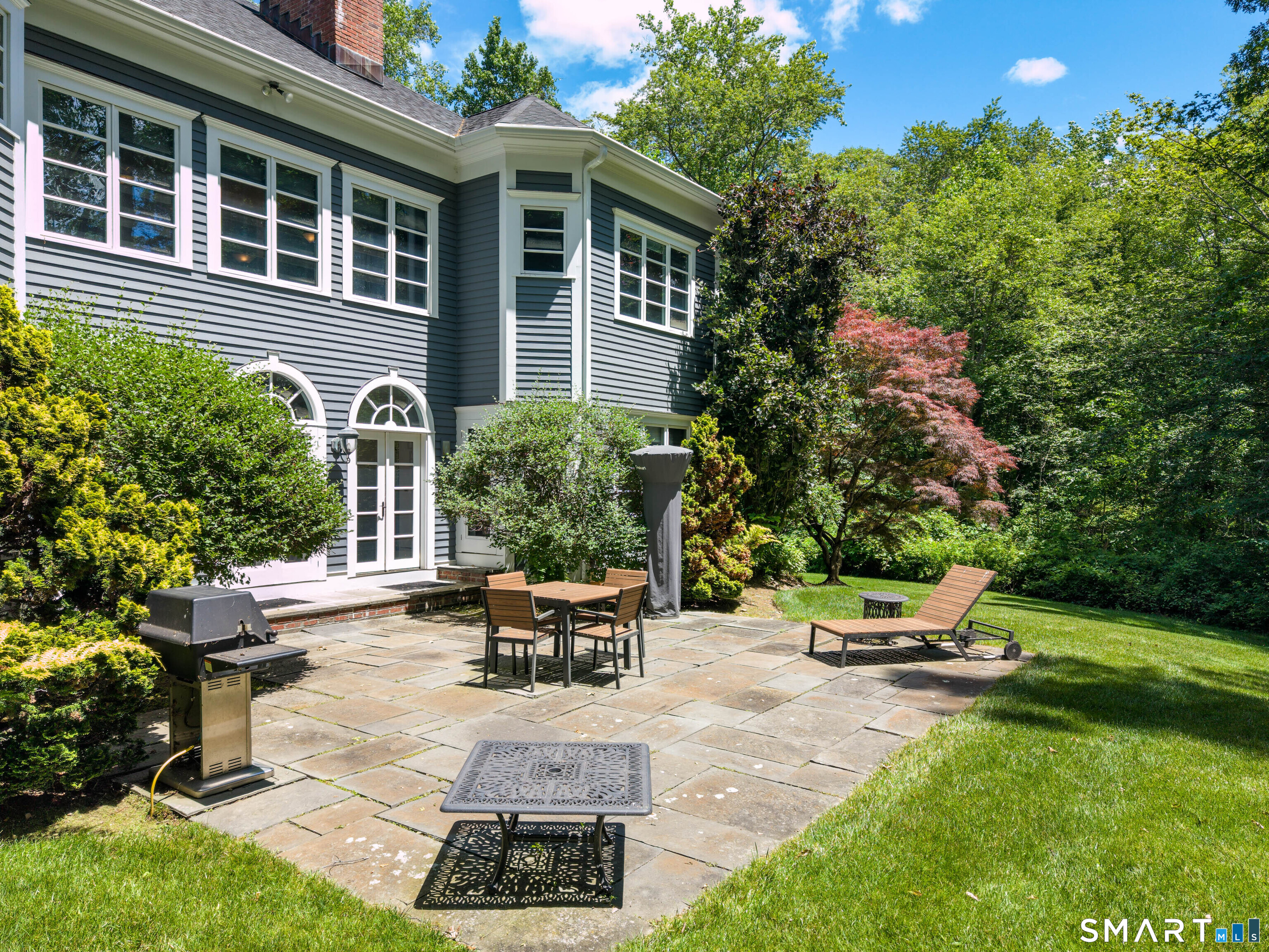 760 Smith Ridge Road New Canaan, CT 06840 - Photo 31 of 40 a view of a backyard with sitting area