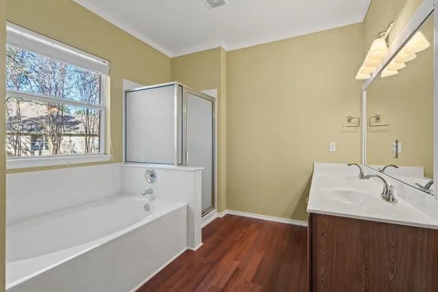 a bathroom with a bathtub and a sink