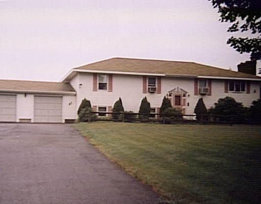20 Podunk Road Sturbridge, MA 01566 - Photo 1 of 1 a front view of a house with garden