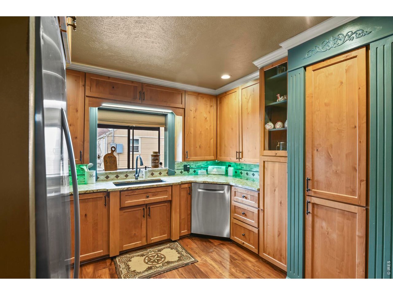 417 2nd Street Fort Lupton, CO 80621 - Photo 6 of 24 a kitchen with a sink and cabinets