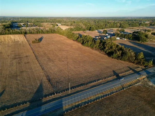 an aerial view of residential building and ocean view