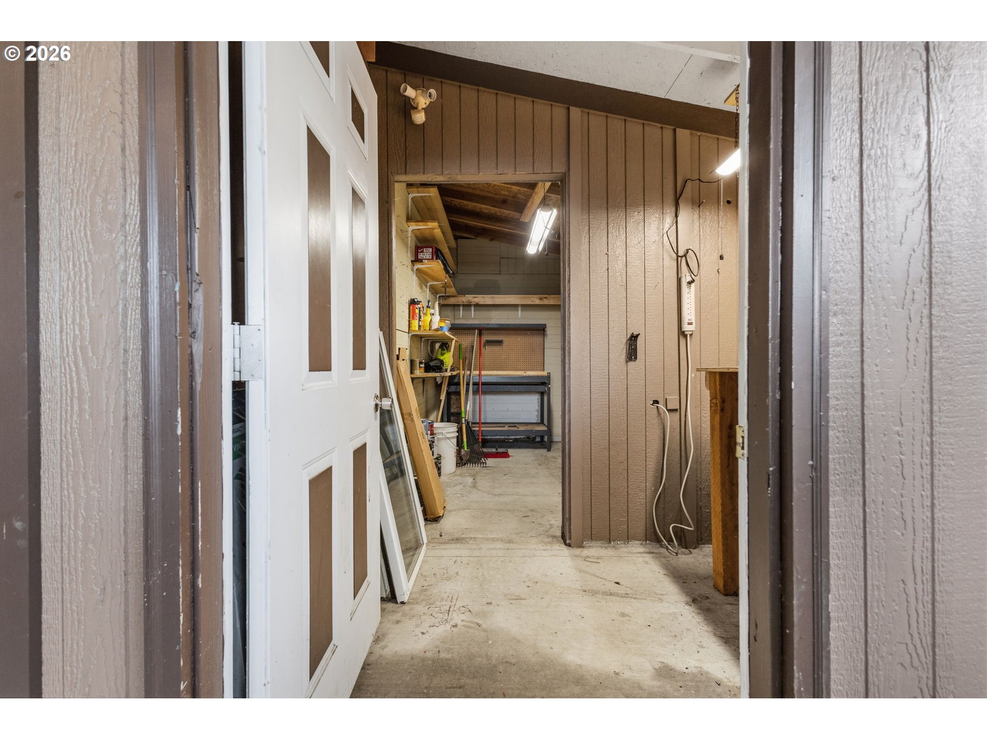 336 Franklin Place Longview, WA 98632 - Photo 22 of 28 a view of a hallway with wooden shelves