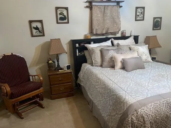 a bedroom with bed and a couch