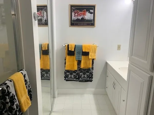 a bathroom with a tub and shower