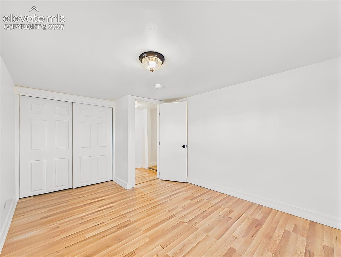 23015 Murphy Road Calhan, CO 80808 - Photo 32 of 50 Secondary Bedroom – Spacious secondary bedroom offers a large closet, new flooring, and abundant natural light.