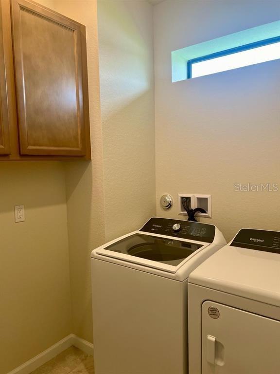 4139 Silver Maple Way Vero Beach, FL 32967 - Photo 11 of 29 a utility room with dryer and washer