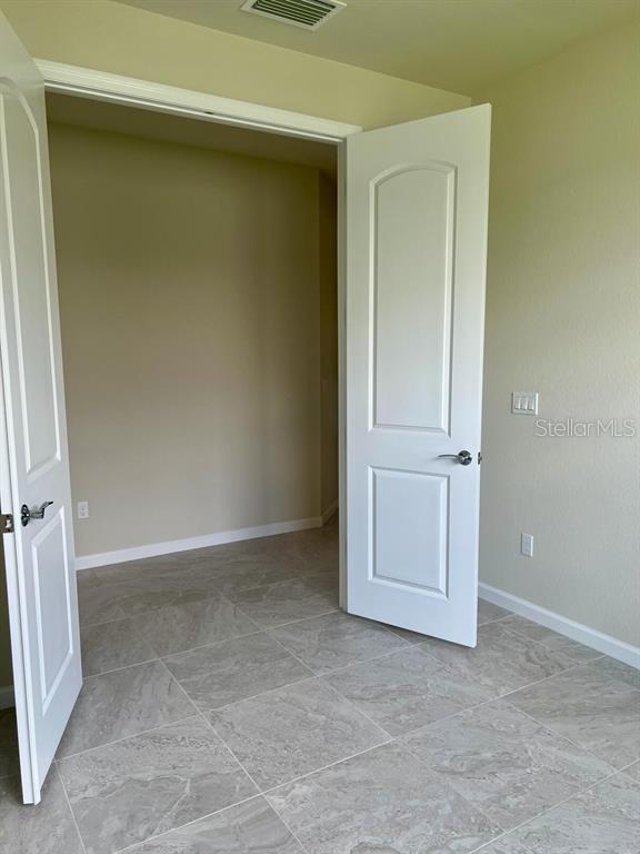 4139 Silver Maple Way Vero Beach, FL 32967 - Photo 15 of 29 an empty room with windows
