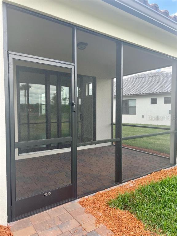 4139 Silver Maple Way Vero Beach, FL 32967 - Photo 21 of 29 a bathroom with a glass shower door