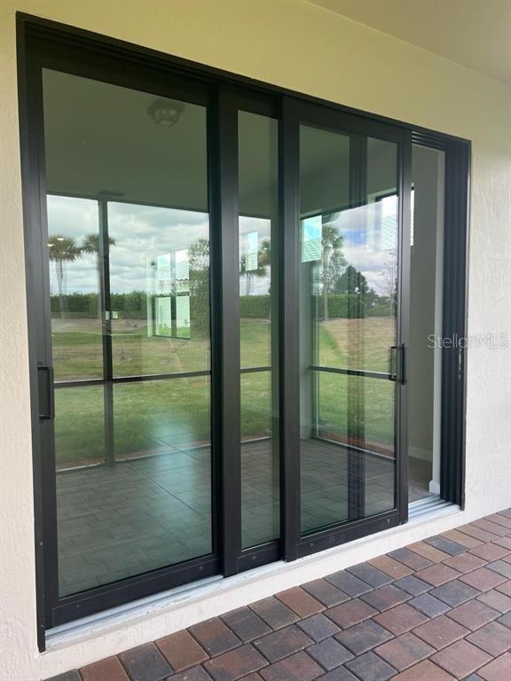 4139 Silver Maple Way Vero Beach, FL 32967 - Photo 22 of 29 a bathroom with a glass door