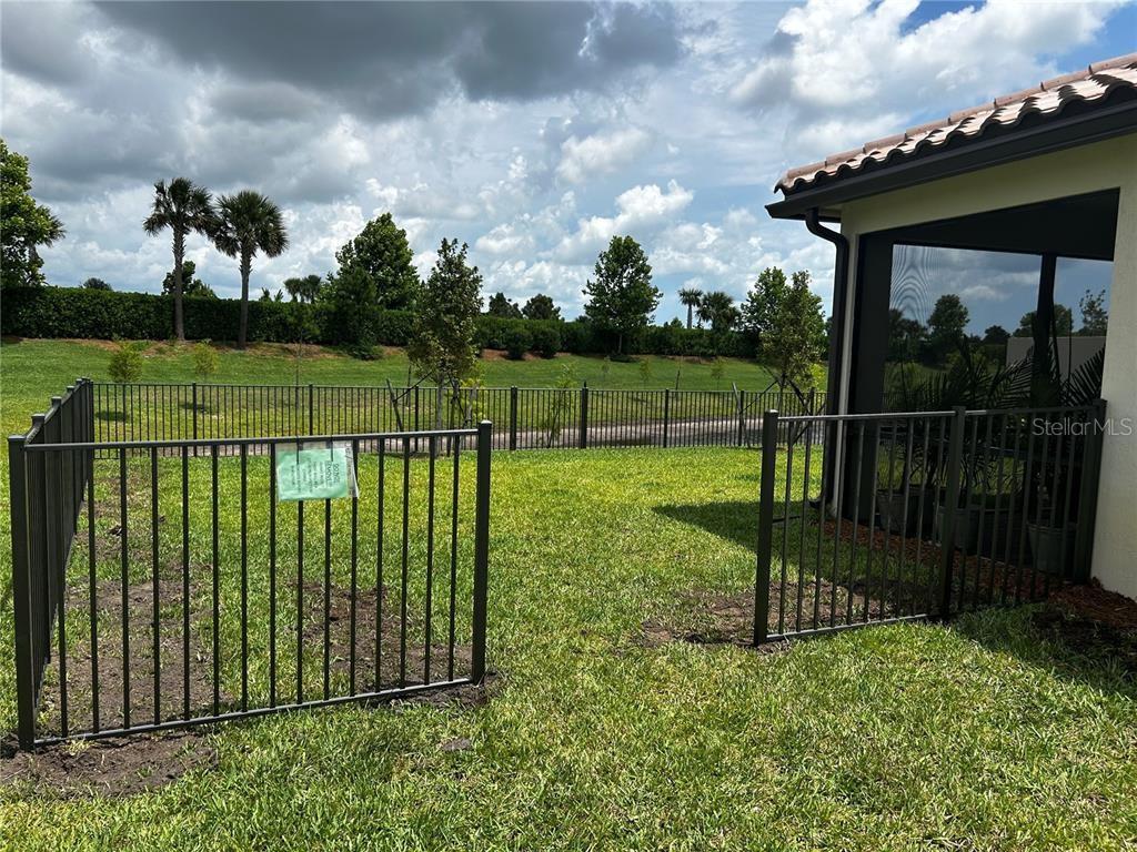 4139 Silver Maple Way Vero Beach, FL 32967 - Photo 26 of 29 a view of a deck with a garden