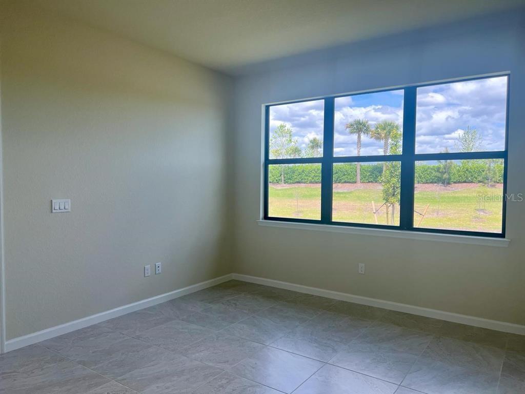 4139 Silver Maple Way Vero Beach, FL 32967 - Photo 5 of 29 an empty room with a window