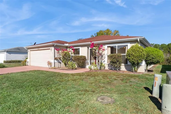front view of a house with a big yard