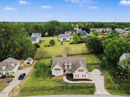 an aerial view of a house with garden