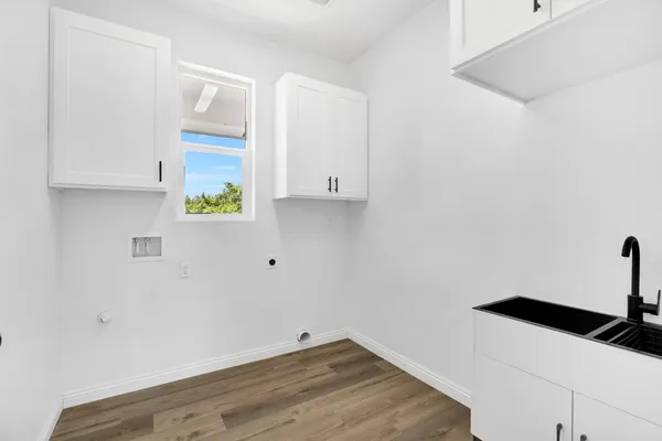 a kitchen with a sink and cabinets