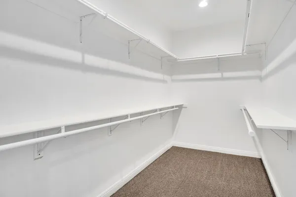 a view of an empty walk in closet