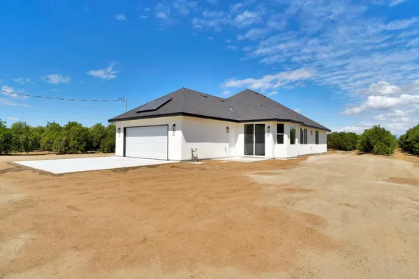 a house with trees in the background
