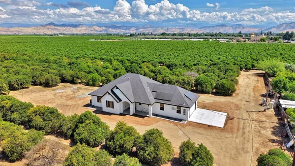 an aerial view of a house with a garden