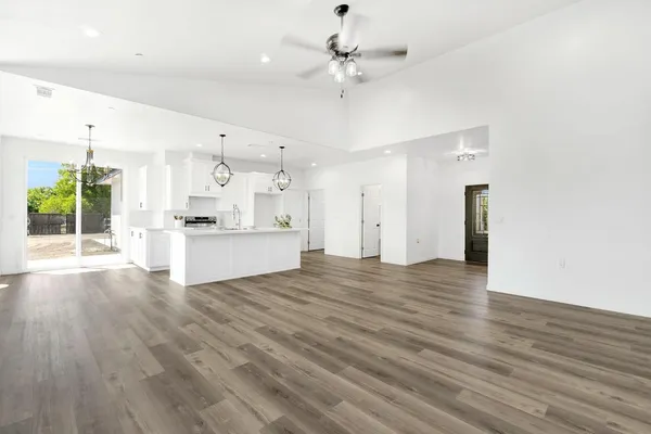 a view of a kitchen with a sink and a window