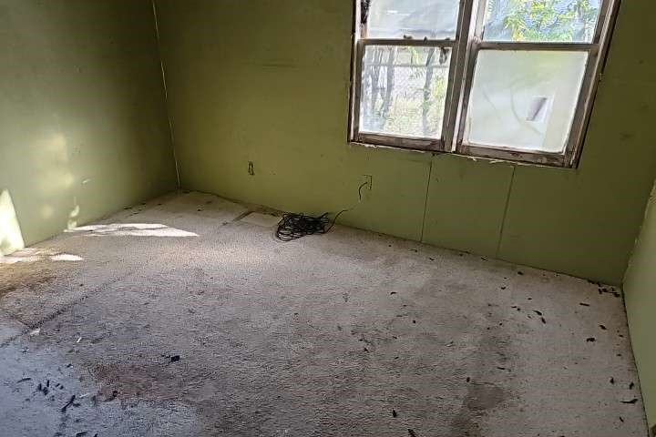 644 16th Street Colorado City, TX 79512 - Photo 6 of 12 a view of an empty room with a window