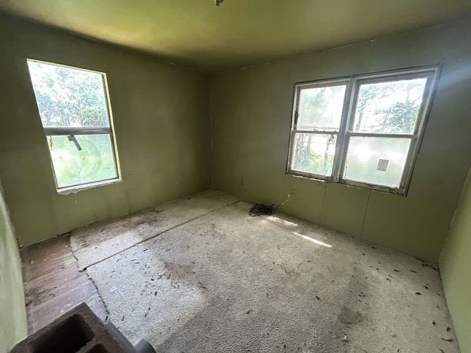 644 16th Street Colorado City, TX 79512 - Photo 8 of 12 an empty room with a window