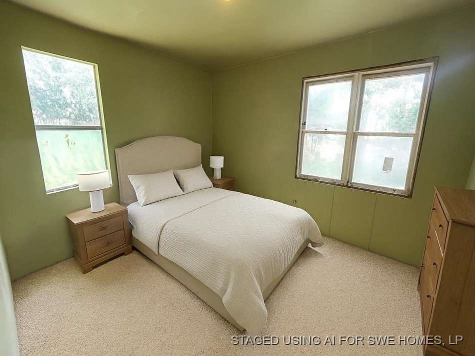 644 16th Street Colorado City, TX 79512 - Photo 9 of 12 a bedroom with a bed and window
