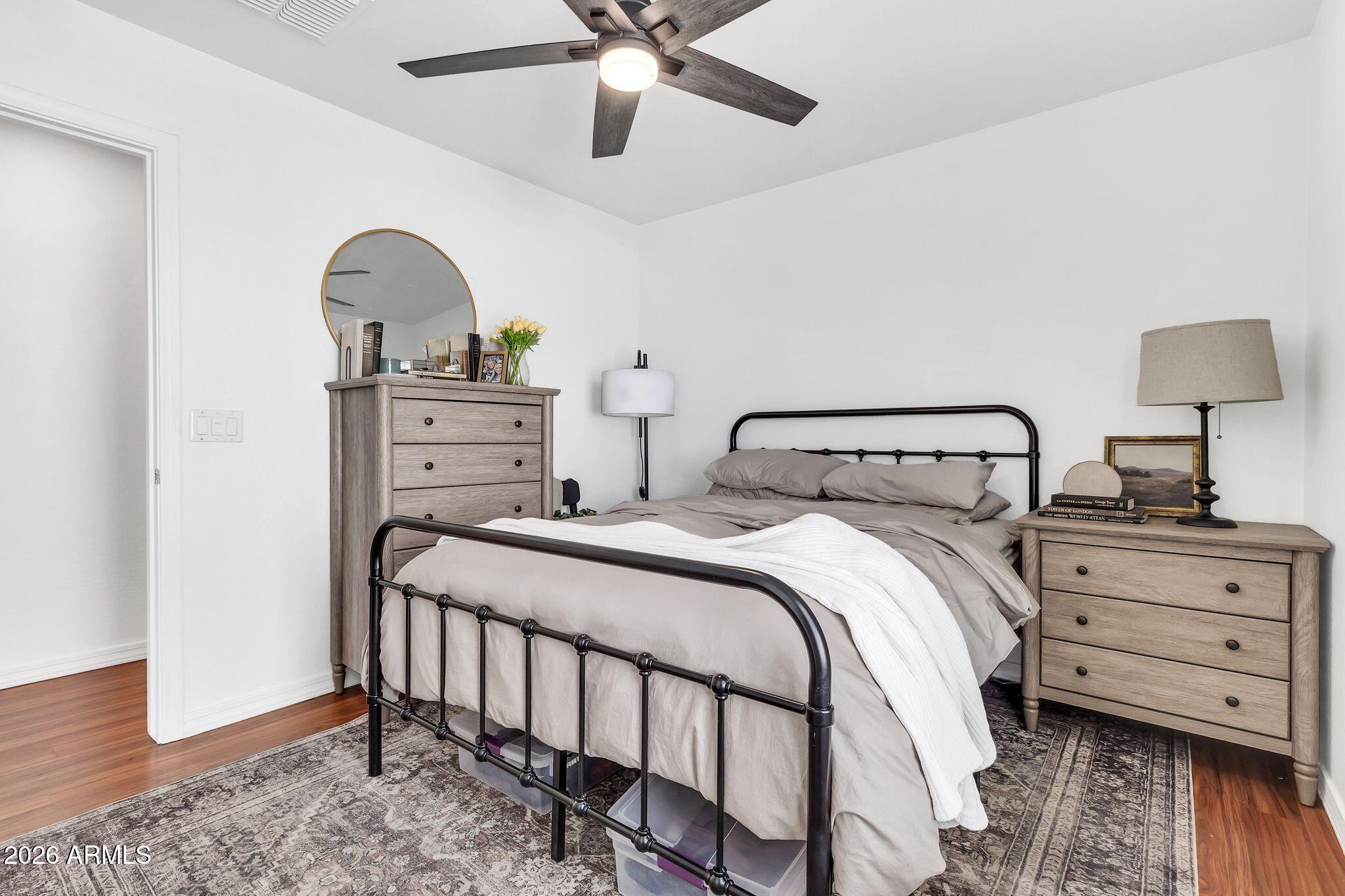 4120 South Butte Lane Gilbert, AZ 85297 - Photo 23 of 29 a bedroom with a bed and a dresser