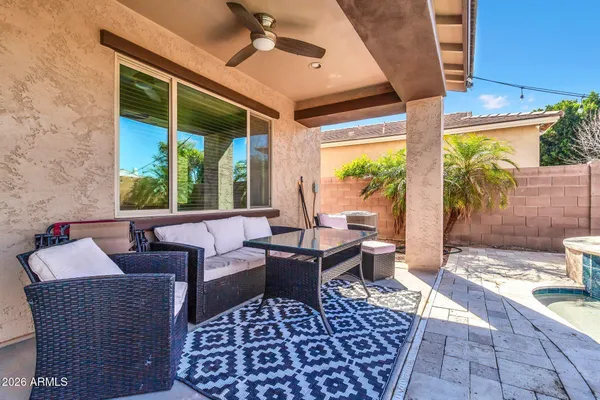a living room with furniture and a large window