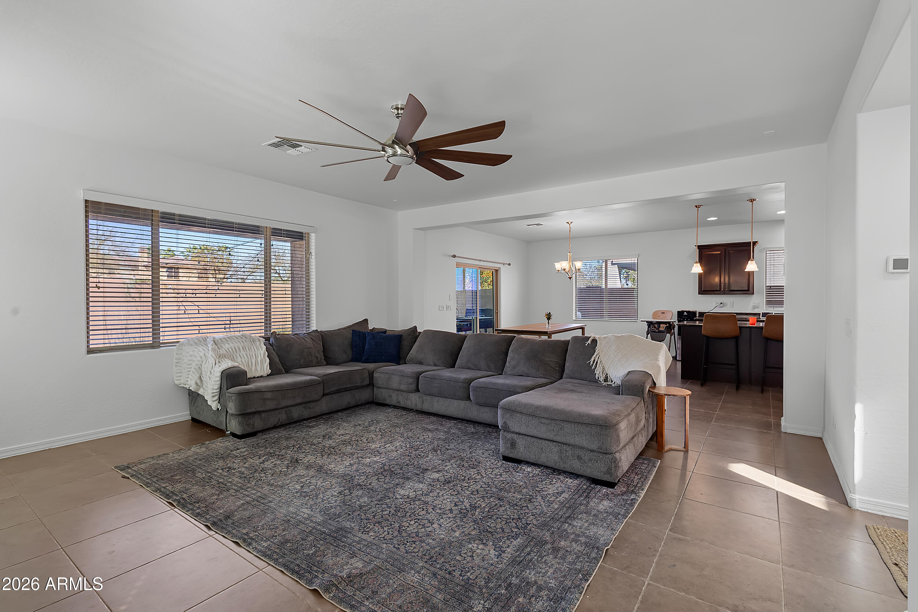 4120 South Butte Lane Gilbert, AZ 85297 - Photo 8 of 29 a living room with furniture and a window