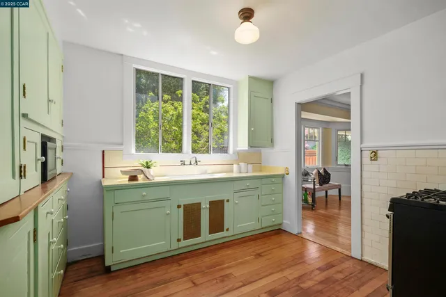 a kitchen with a sink and wooden cabinets