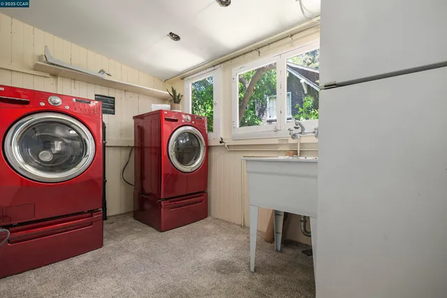 a view of a storage & utility room with washer and dryer