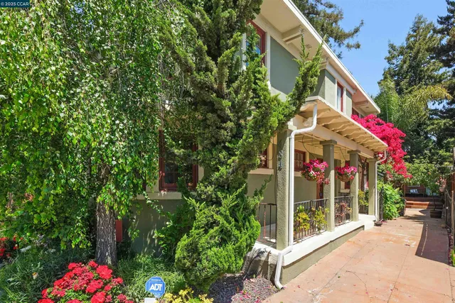 a view of a house with fountain and porch