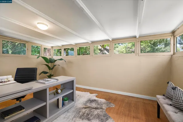 a view of workspace with furniture and window