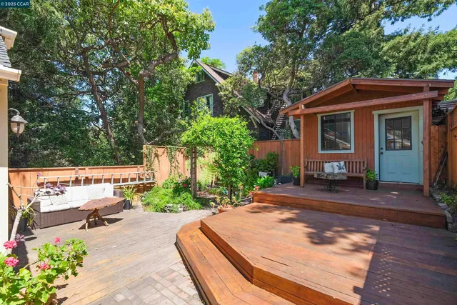 a view of a house with a yard siting area and garden