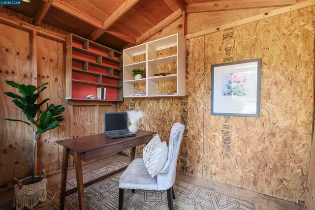 a view of a workspace with furniture