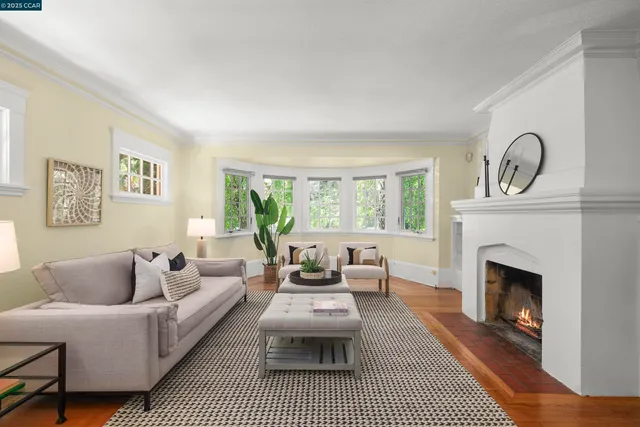a living room with furniture a window and a fireplace