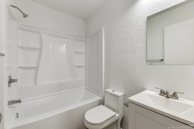 a bathroom with a sink toilet and bathtub
