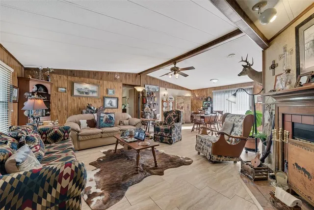a view of a a dining room with furniture window and wooden floor