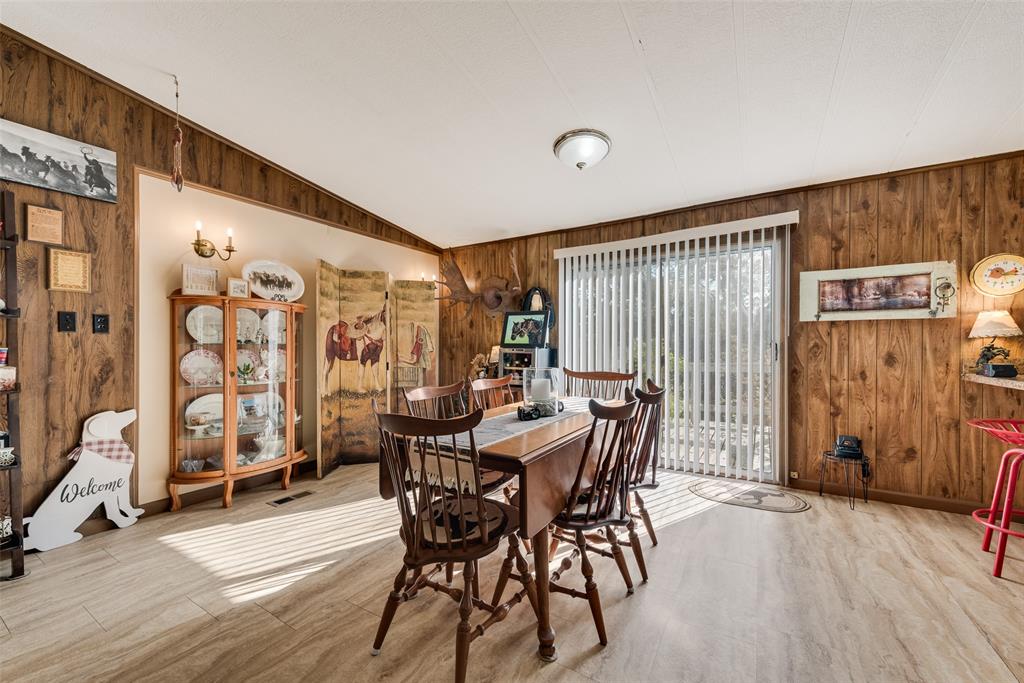 510 North D Ranch Road Waxahachie, TX 75167 - Photo 12 of 38 a view of a a dining room with furniture window and wooden floor