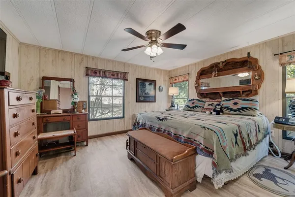 a bathroom with a double vanity sink mirror and bathtub