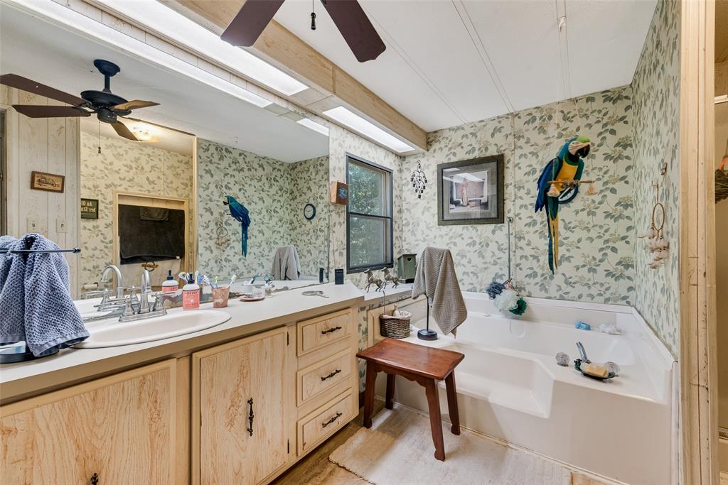 510 North D Ranch Road Waxahachie, TX 75167 - Photo 16 of 38 a bathroom with a double vanity sink mirror and bathtub