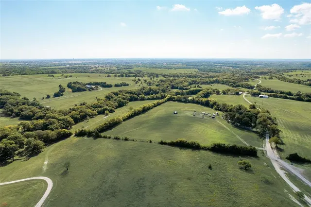 an aerial view of a houses with outdoor space