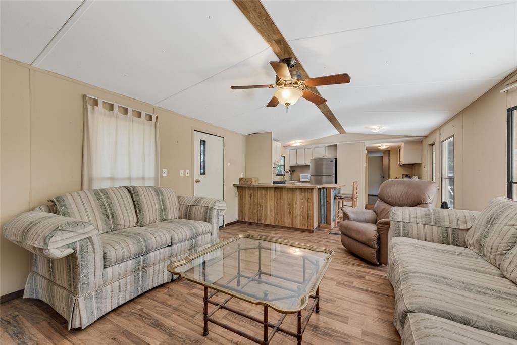 510 North D Ranch Road Waxahachie, TX 75167 - Photo 23 of 38 a living room with furniture kitchen view and a chandelier