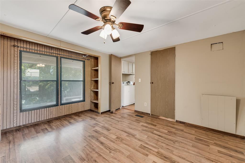 510 North D Ranch Road Waxahachie, TX 75167 - Photo 29 of 38 a view of an empty room with a window and wooden floor