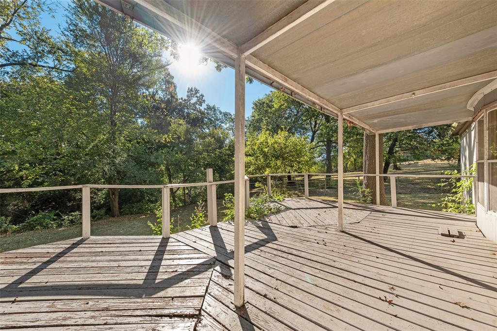 510 North D Ranch Road Waxahachie, TX 75167 - Photo 32 of 38 a view of balcony with wooden floor and iron fence