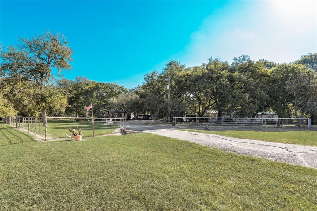 510 North D Ranch Road Waxahachie, TX 75167 - Photo 8 of 38 a view of a swimming pool with an outdoor space and seating area